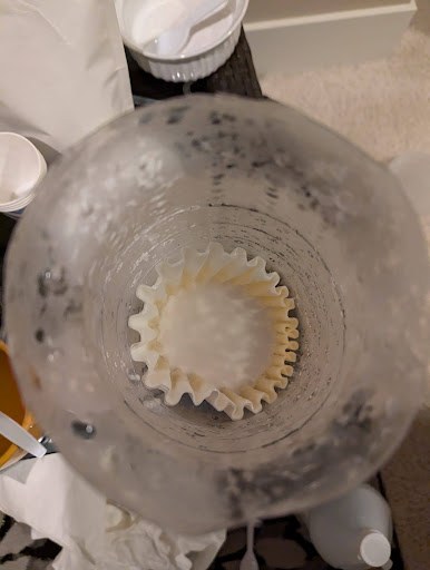 Filtering calcium hydroxide slurry through a paper filter