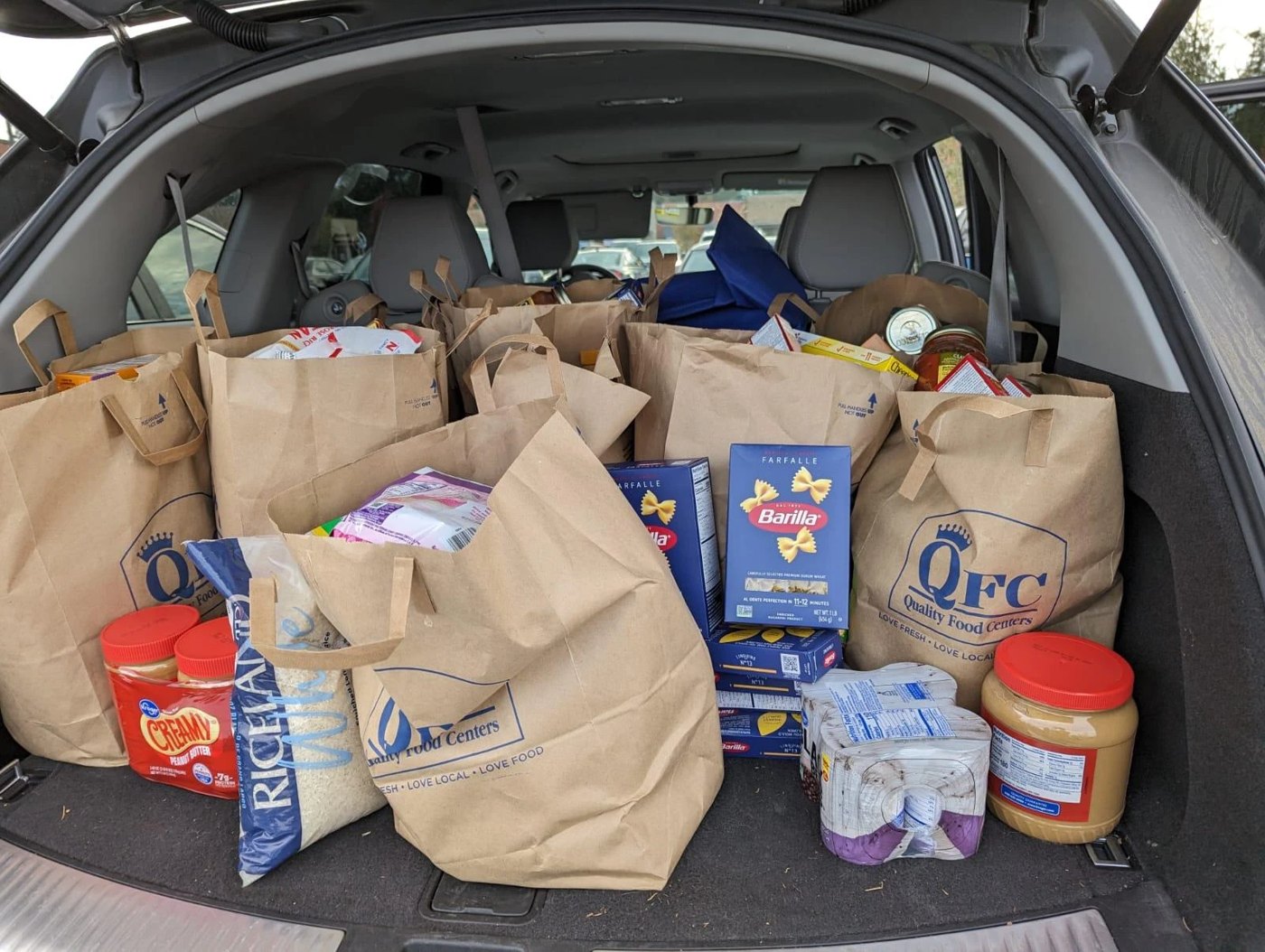 Car trunk full of donated groceries