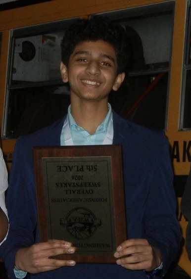 Smaran smiling and holding the Washington State Forensic Association 2026 overall sweepstakes 5th place plaque